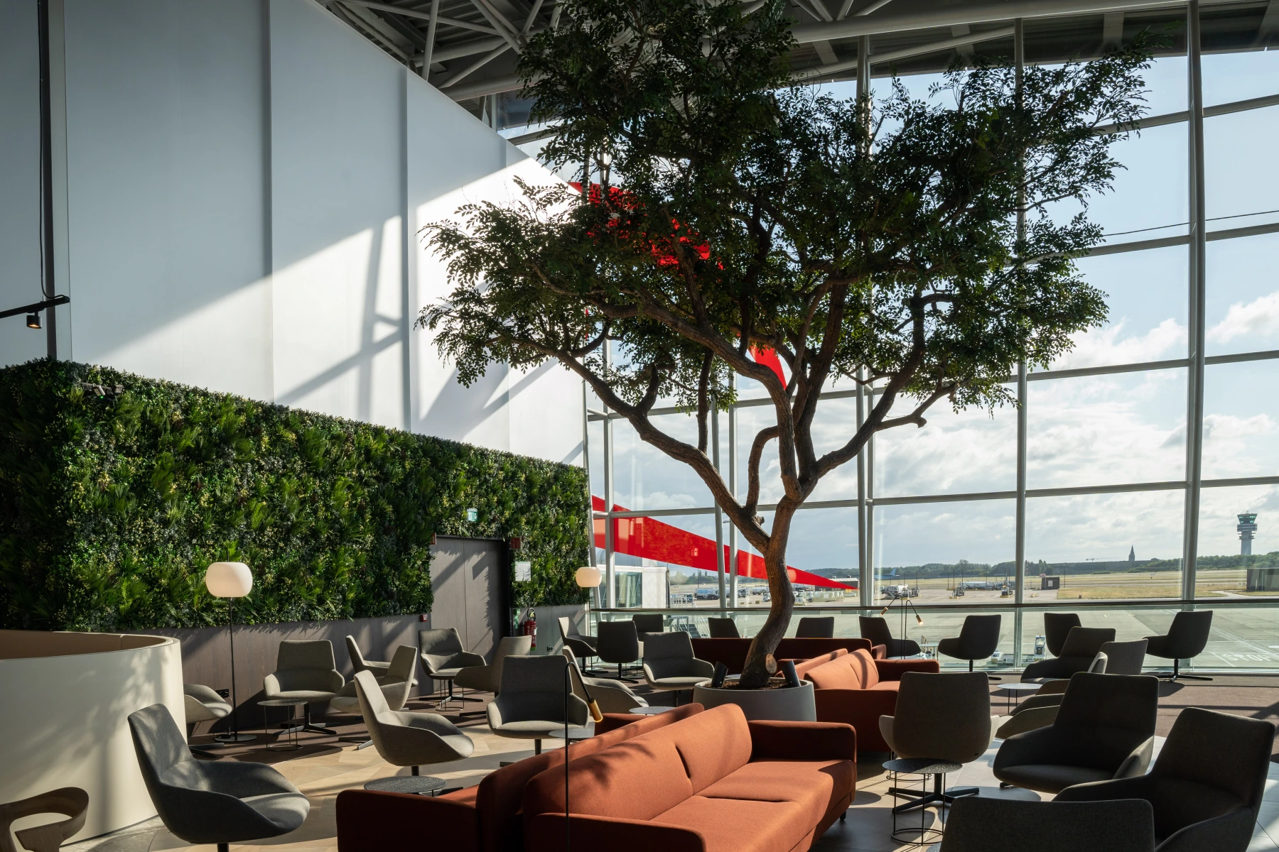 Lounge with tree and seating.