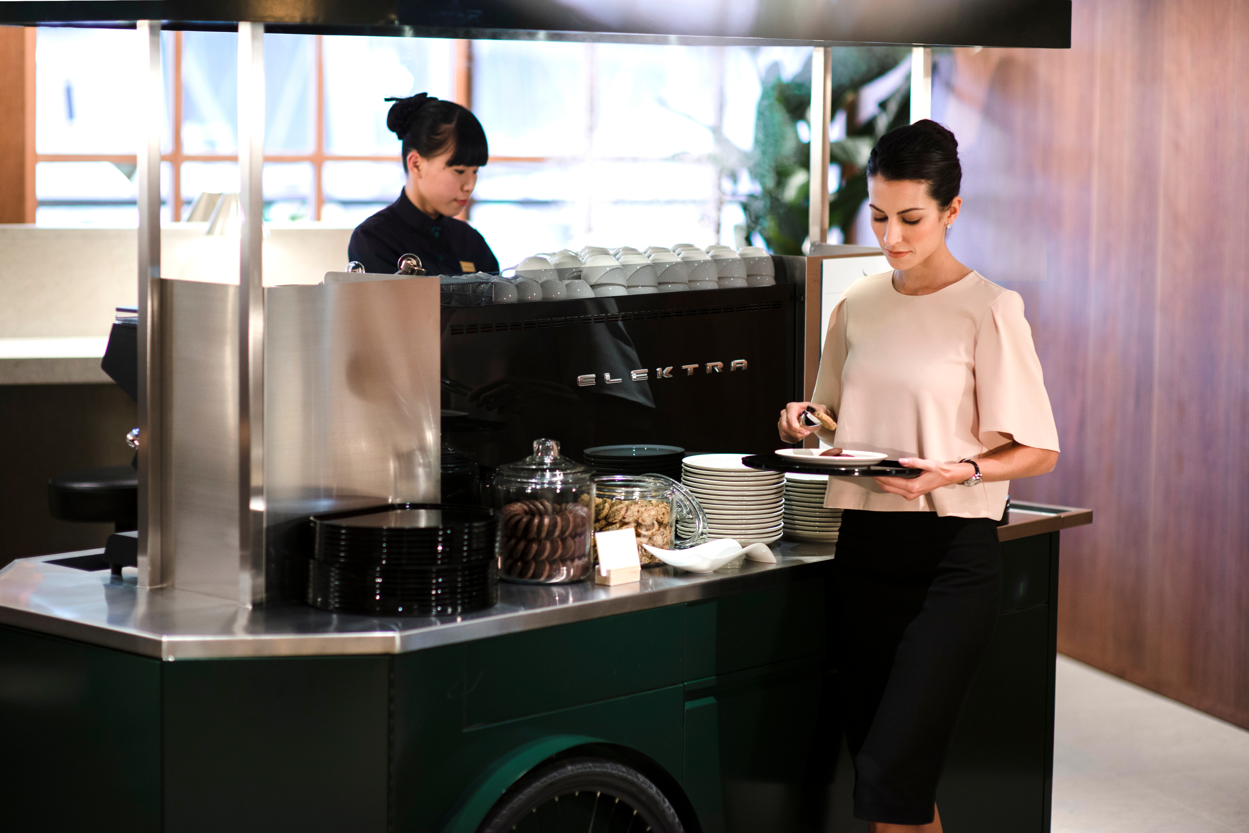 Guest choosing food from the buffet table.