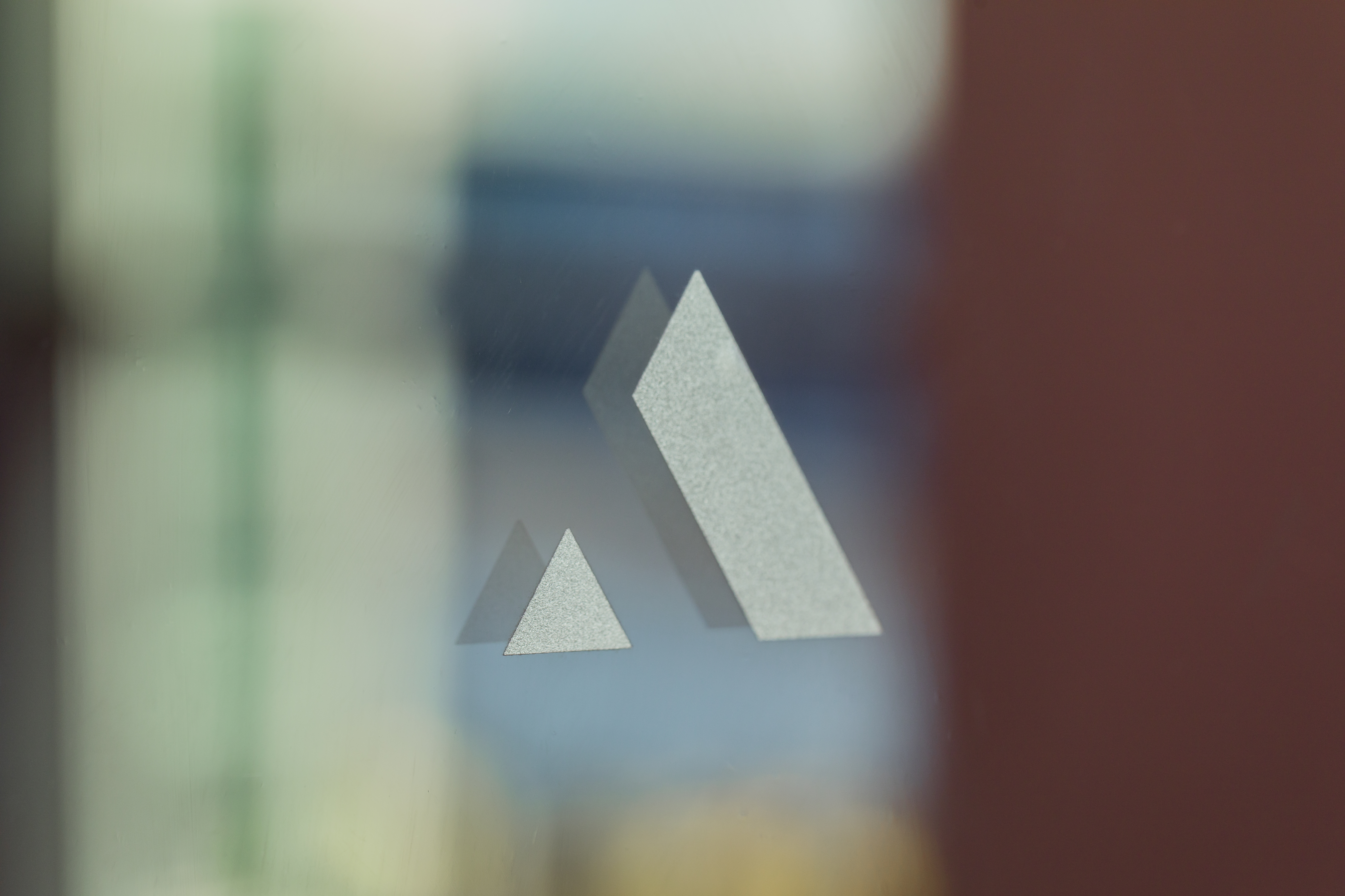 The Aspire 'A' emblem on a window
