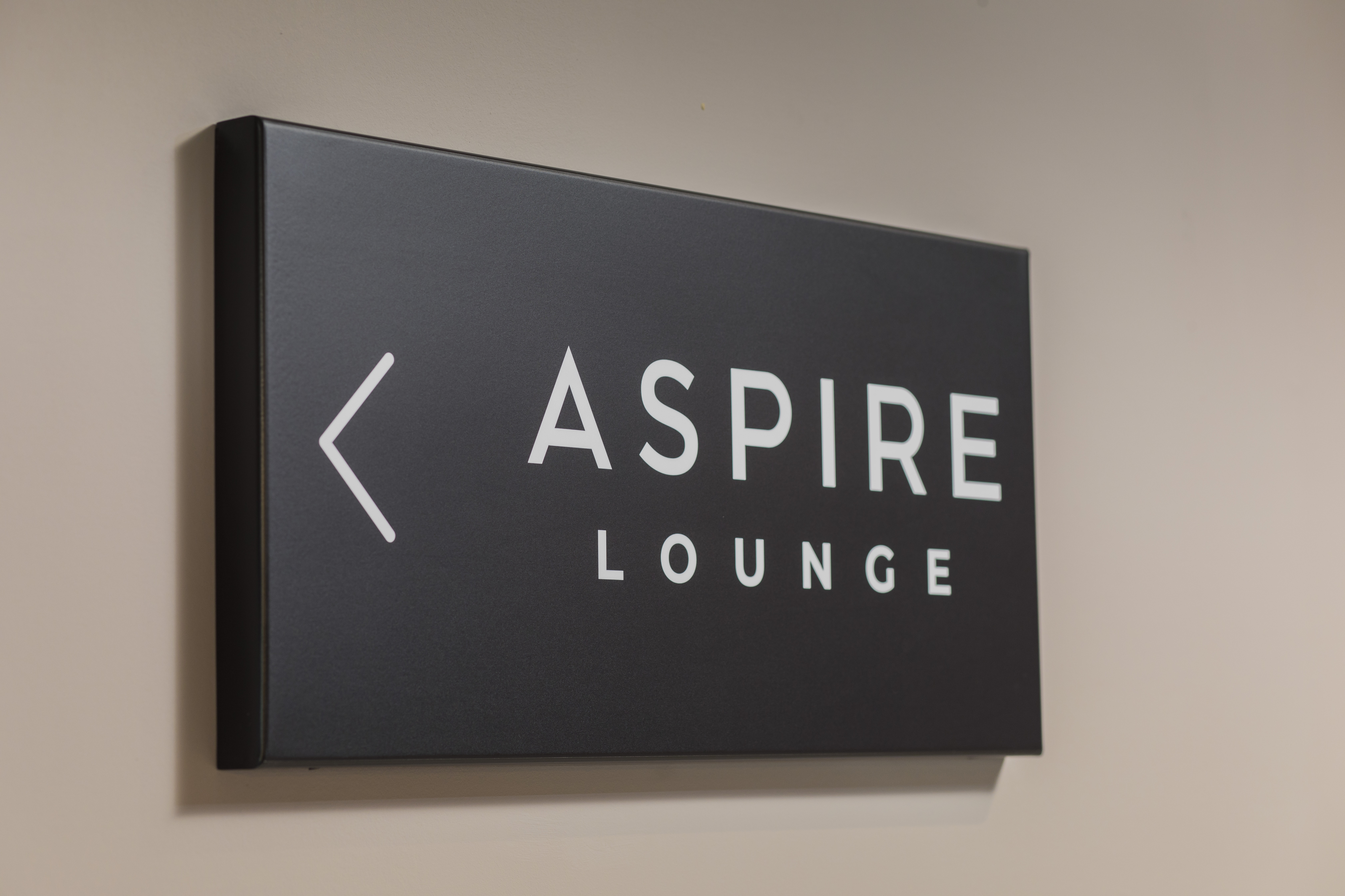 Sign directing customers to the Aspire Lounge